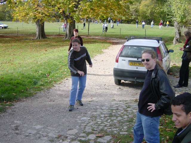 Yves just threw the boule, Josh and Dom look satisfied