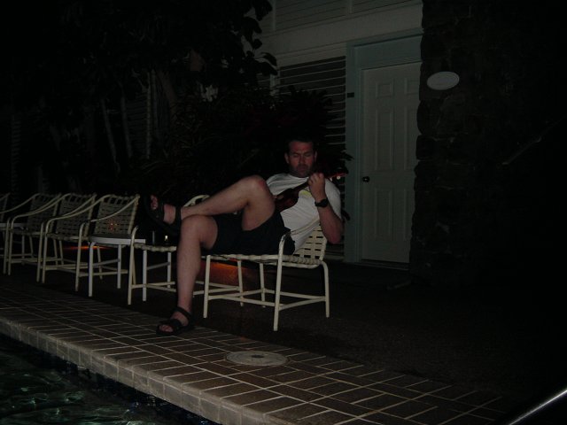Daniel playing his Ukulele by the pool