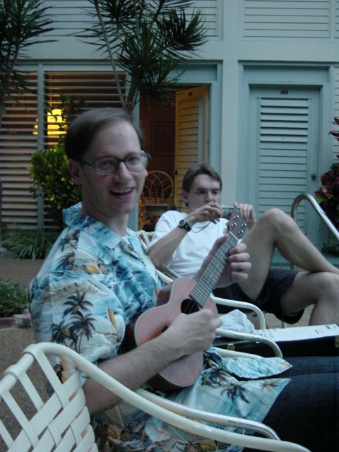 Jose playing his Ukulele and max taking a picture in the background