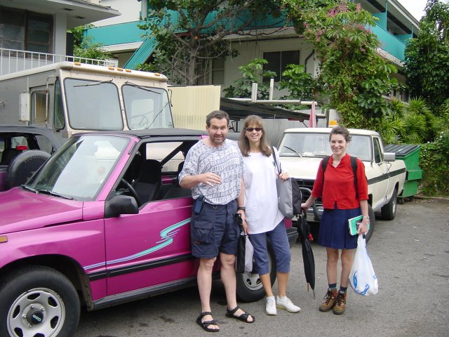 At the car rental: our rental, a flashy pink 4WD, Daniel, Caroline and Christelle