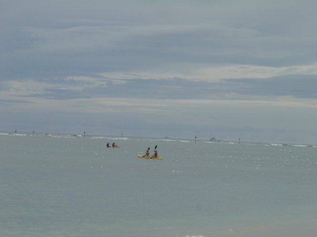 Canoes on silver ocean