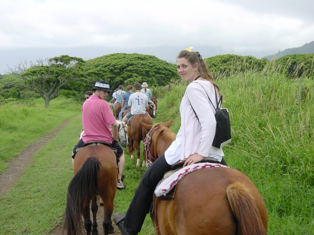 Coralie riding Buddha the crazy rodeo horse, Olivier, others in front