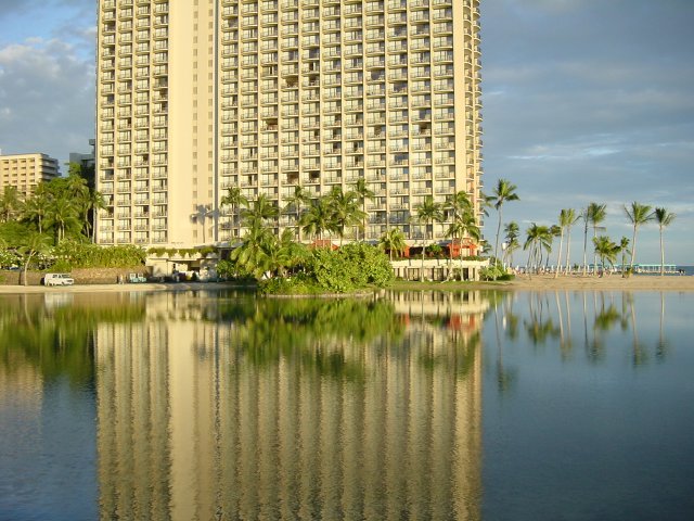 Reflection of a large and high building on the lake