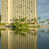 Reflection of a large and high building on the lake