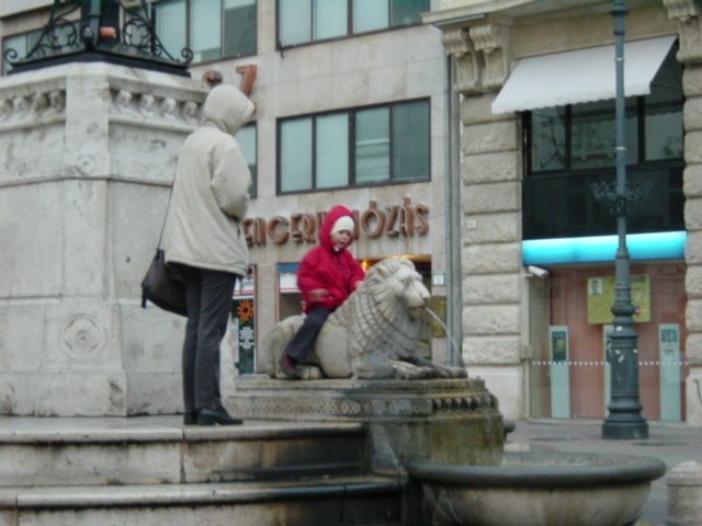 Child lion-riding on the fountain