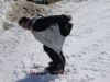 Pticul en position aerodynamique sur ses patinettes