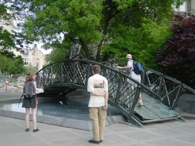 Nicole, Max and Dean climbing the bronze bridge to meet the bronze man