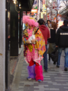 Man costumed as a colorful dragon