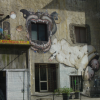 Large dog painted on an old building