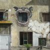 Large dog painted on an old building