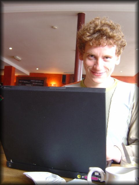 EricP smiling behind his computer