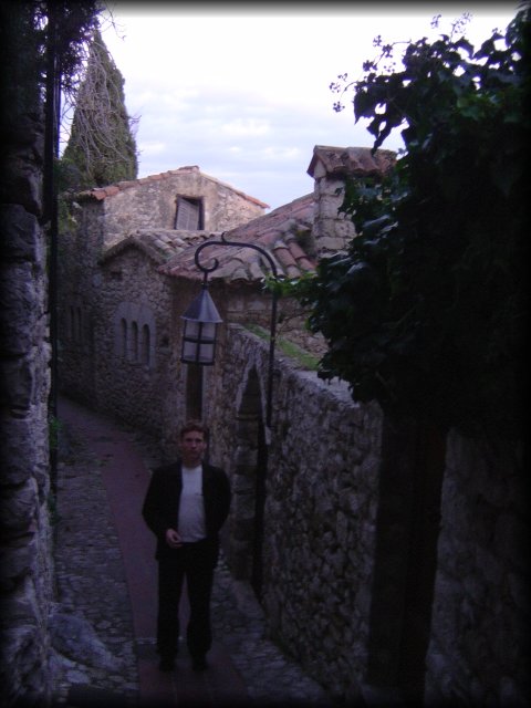 ericP standing in a narrow alley in Eze village