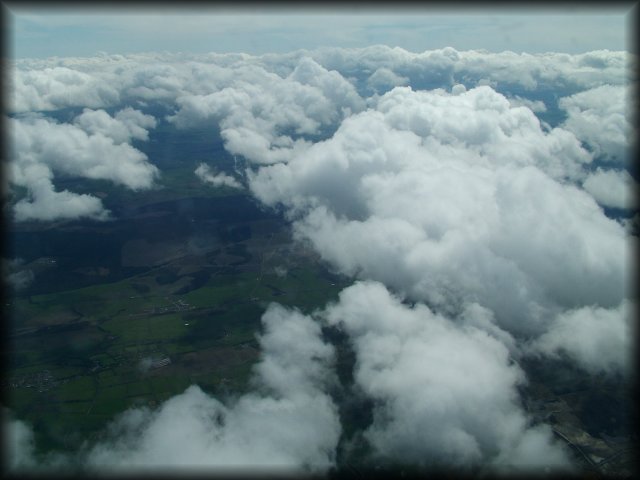 The aircraft took off from London Stansted and below us is a field of clouds and below them are fields of crop and below them...