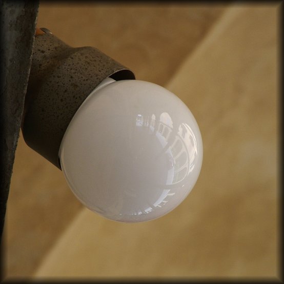 Arcades reflected in a bulb.