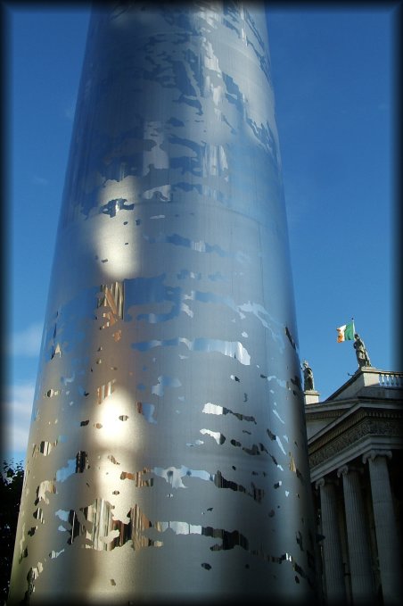 Spire of Dublin. The Spire of Dublin is a large, pin-like monument, 120 metres (393 ft) in height and lit from the top, whose erection was completed on January 21, 2003 on the site of the former Nelson Pillar on O'Connell Street in the Irish capital, Dublin. (words taken from the wikipedia entry)