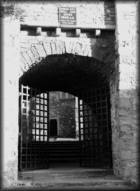 The sign above the gate reads Dublin City Wall and Gates 1240 A.D.