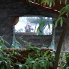 Me in another mirror. Hanging from the stone wall in the patio of the Old Monastery Hostel.