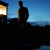 This is a night shot! (00:25) It just doesn't get quite dark in Olso right now.  Sculpture of a man on the bridge in the Vigeland Sculpture Park.