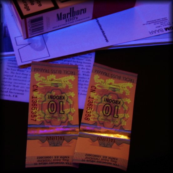 Black light on white paper, cigarettes, 2 tramm tickets (in the Depeche Mode baar of Tallinn)