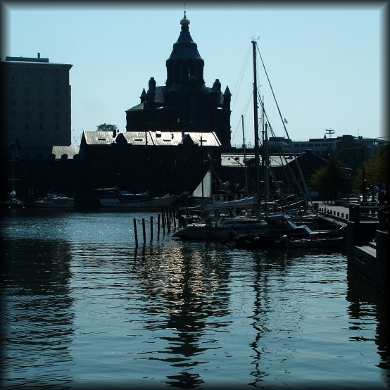 The Uspenski Orthodox cathedral and its golden reflection in the water of the harbour.