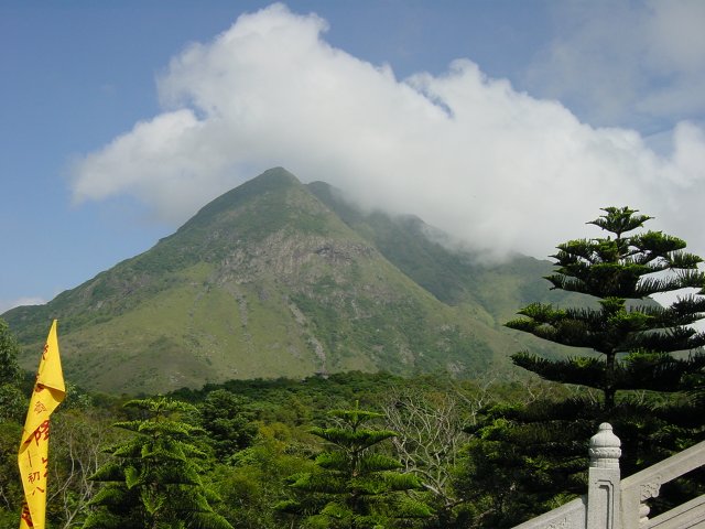 Green mountain with a cloud