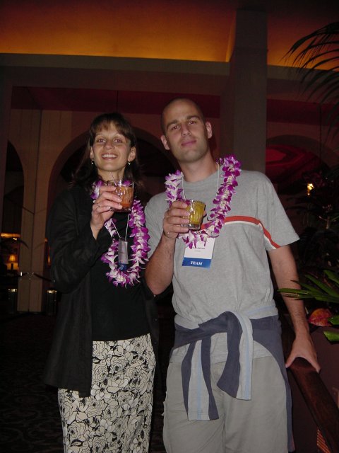 Caroline and Dean holding cocktails