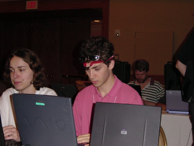Carine and Olivier in front of their laptops