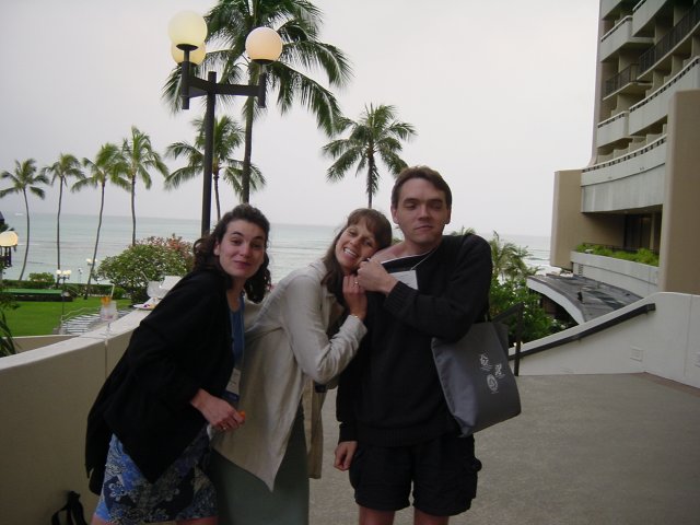 Christelle and Caroline leaning on Max's shoulder