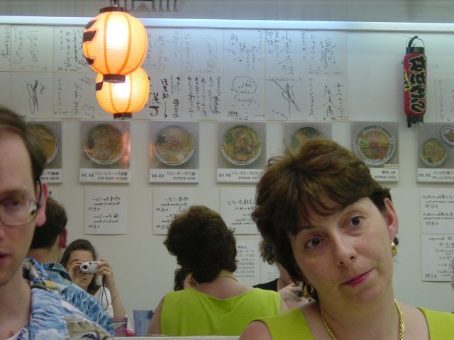 Half of Jose's face, Marie. In the mirror: Jose's head, Coralie taking the picture, Marie's head