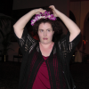 Amy afixing a lei on her head