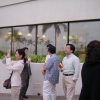 Saeko taking a picture of the rainbow, Japanese folks behind, Christelle and Nicole chatting on the right