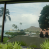 Reflection of Carine, Yves and Diamond Head on a window