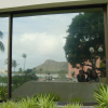 Reflection of Carine, Coralie, Yves and Diamond Head on a window