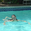 Caroline in the swimming pool, smiling this time