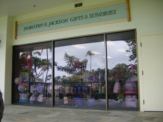 Waikiki landscape reflected in the window of a gift shop