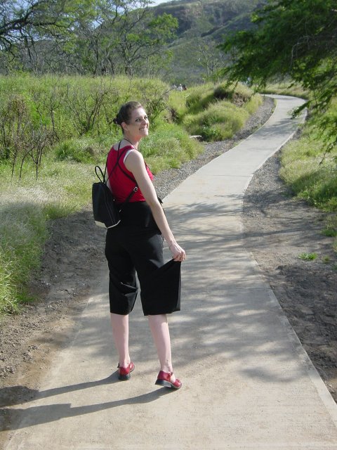 Coralie holding up the sleeves of her trousers