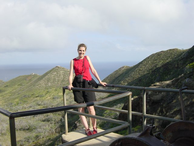 Coralie, pyramid-like hills and ocean behind