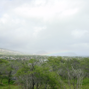 Long and flat rainbow on the ocean, view from the foot of Diamond Head