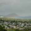 Rainbow over a patch of sunbathed land