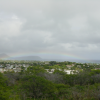 Long and flat rainbow on the ocean, view from the foot of Diamond Head