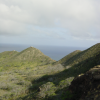 Inside the crater, pyramid like hills and ocean in the back