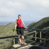 Coralie, pyramid-like hills and ocean behind