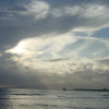 Cloudy sky over the ocean, last rays of sun of the day