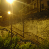 Night photo: Stairs, street light, brick walls, shrubberies