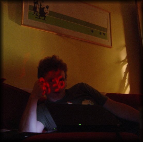 digital clock projected on ericP's face