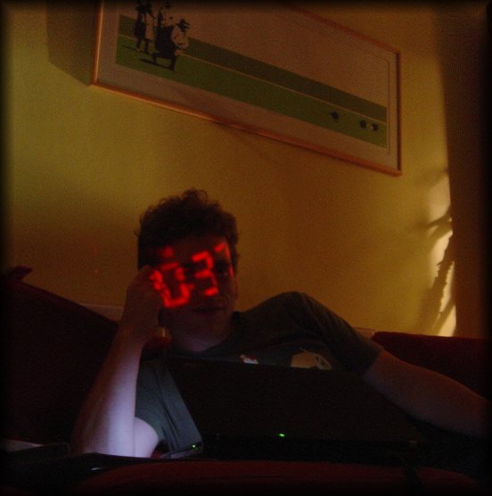 digital clock projected on ericP's face
