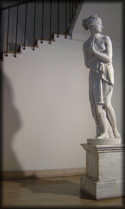 A statue near a staircase playing hide and seek with its shadow, Firenze
