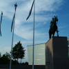This is the statue of Gustaf Mannerheim, the Marshal of Finland. Three flags. 